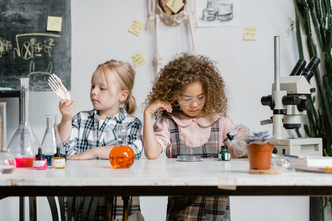Kids doing a science experiment at home - kitchen science activities for children